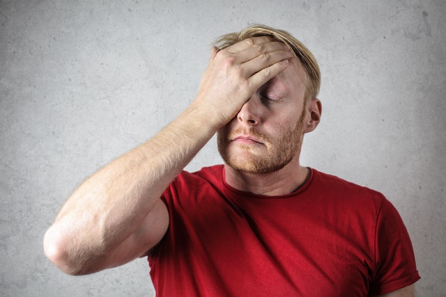 Photo by Andrea Piacquadio: https://www.pexels.com/photo/a-man-in-red-shirt-covering-his-face-3760043/