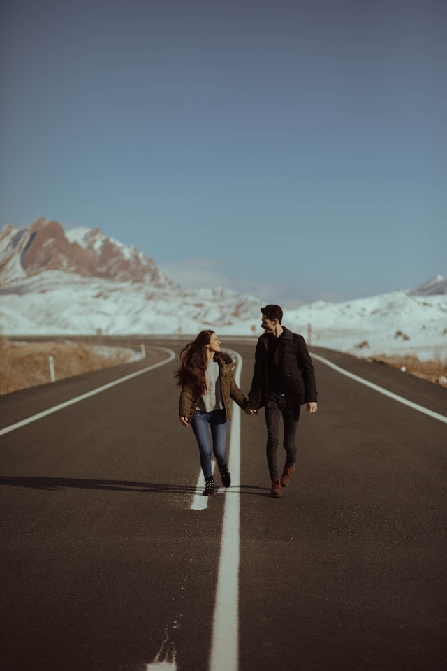 Photo by Adil: https://www.pexels.com/photo/man-and-woman-walking-on-road-2739305/