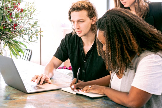 Photo by Canva Studio: https://www.pexels.com/photo/man-working-on-laptop-while-woman-takes-notes-3153199/