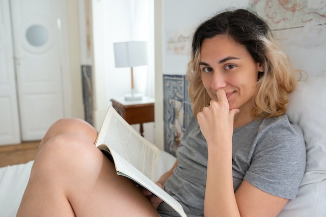 Photo by Kampus Production: https://www.pexels.com/photo/a-woman-in-bed-with-a-book-7556633/