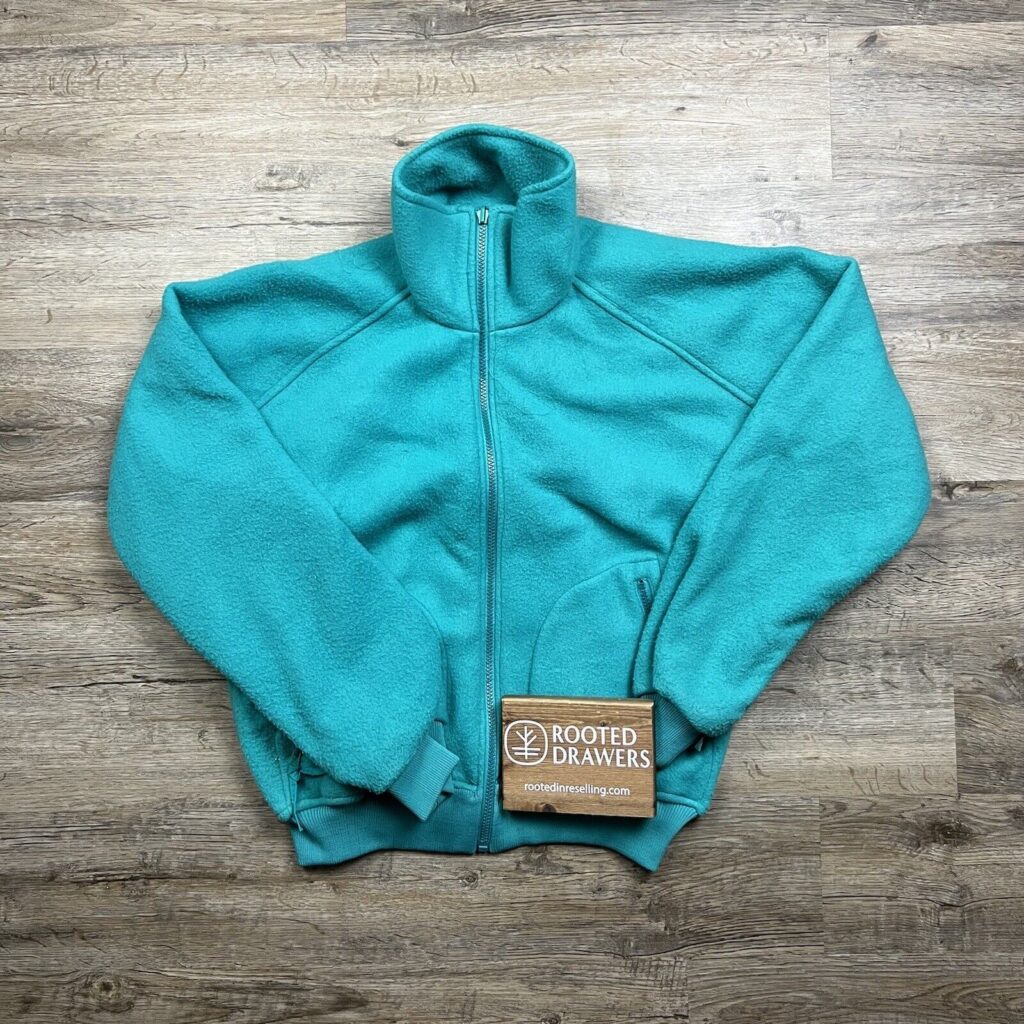 Womens blue turtle neck fleece sweater from Rooted in Reselling