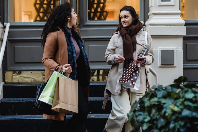 Ladies coming from thrift store with purchases that help the less fortunate