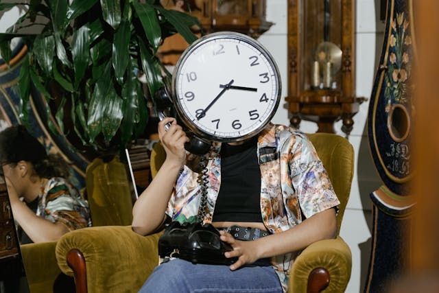 flipping junk removal for resellers.  Woman with clock for face answering old rotary phone.