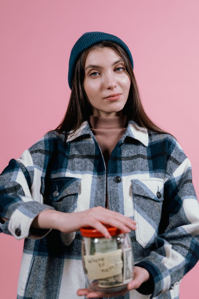 woman with money in a jar